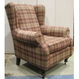 A Next "Sherlock" traditional style wing chair with rolled arms and check upholstery