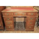 A Victorian walnut kneehole writing desk of nine drawers, with inset top on plinth base, 108cm wide