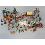 Collection of vintage model toys, mostly Britains, with a wild west theme including Herald series