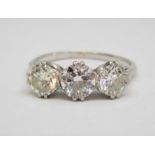 Good quality early 20th century platinum three stone diamond ring, centre stone 0.75cts approx, each
