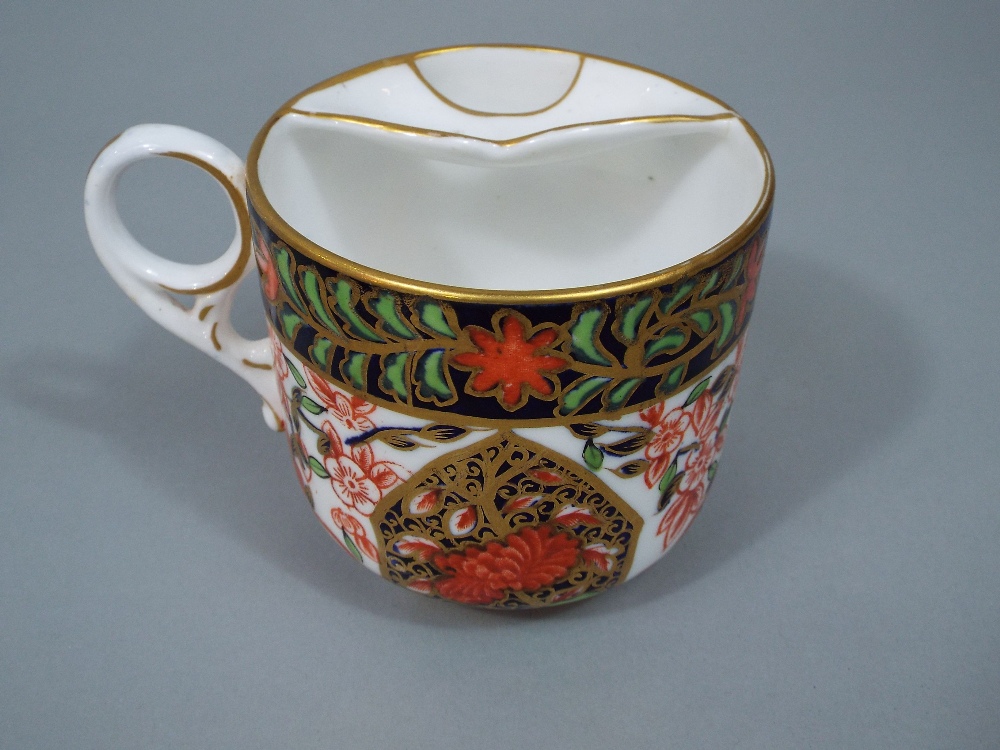 Crown Derby Imari moustache cup and saucer, with panels painted with birds and typical gilt - Image 2 of 4