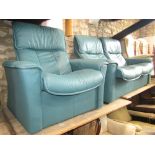 A two seat sofa and matching armchair and footstool by Ekornes with reclining action, the chair with