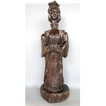 Early carved soft wood figure of a standing female with unusually long neck, in the primitive