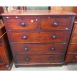 A Victorian mahogany bedroom chest of two short over three long graduated drawers with turned