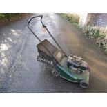 A Hayter Hunter 41 petrol driven self propelled rotary lawn mower and grass collection bag