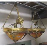 A pair of mottled orange coloured glass plafonnier/hanging ceiling lights set within brass frames