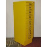 A Ryman Conran yellow painted steel floorstanding filing cabinet fitted with fifteen index drawers