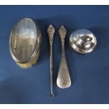 A mixed lot to include a silver topped dressing brush, a silver button hook and shoe horn and a