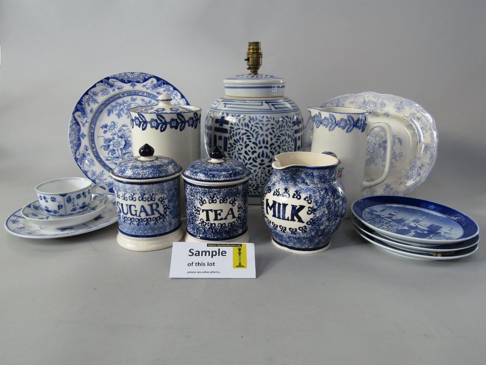 A pair of Emma Bridgewater tea and sugar storage jars and covers with blue sponged decoration