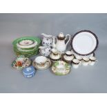 A collection of Royal Worcester coffee wares with blue and gilt fruiting vine border decoration