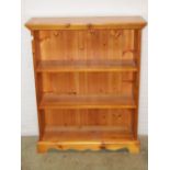 A Victorian pine washstand on two tiers with cut out central bowl receptacle and frieze drawer to