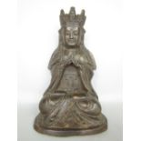 Unusual Eastern bronze study of a seated Buddhistic deity of female form wearing a crown, in the