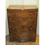 A small good quality oak bow fronted chest of four long graduated drawers, with caddy top raised