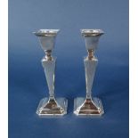 A pair of 1930s Art Deco square tapered candlesticks upon stepped square bases, maker J B Chatterley