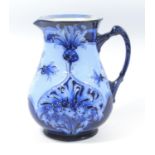 A MACINTYRE AND CO. MOORCROFT 'CORNFLOWER' PATTERN FLORIAN WARE JUG, OF BALUSTER FORM, THE RAISED