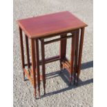 A NEST OF THREE EDWARDIAN RECTANGULAR MAHOGANY TABLES EACH WITH A SATINWOOD CROSSBANDED TOP ON