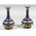 A PAIR OF JAMES MACINTYRE EARTHENWARE VASES, LATE 19TH CENTURY, OF GUGLET FORM PRINTED IN UNDERGLAZE