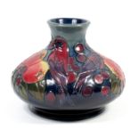 A MOORCROFT POTTERY VASE OF SQUAT BALUSTER FORM, TUBELINED AND PAINTED IN THE 'FINCHES AND FRUIT'