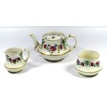 A MACINTYRE AND CO. MOORCROFT 'FORGET ME NOT AND PINK ROSES' FLORIAN WARE TEA SET, OF SQUAT BALUSTER