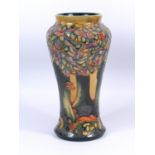 A MOORCROFT POTTERY VASE OF INVERTED BALUSTER FORM, TUBELINED AND DECORATED IN THE 'KNIGHTWOOD'