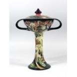 A MOORCROFT POTTERY 'SYMPHONY' PATTERN TWIN HANDLED CHALICE WITH SHALLOW COVER, DECORATED WITH