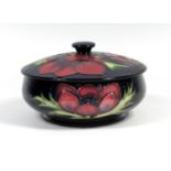 A MOORCROFT POTTERY BOWL WITH COVER, TUBELINED AND PAINTED WITH THE ' ' PATTERN, IMPRESSED '