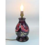A MOORCROFT POTTERY LAMP BASE, CIRCA 1990'S, OF BALUSTER FORM, TUBELINED AND PAINTED WITH THE '