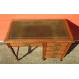 EDWARDIAN LADY'S WALNUT FIVE DRAWER SINGLE PEDESTAL DESK WITH GREEN TOOLED LEATHER INLAY, ON