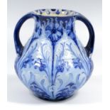 A MACINTYRE & CO. MOORCROFT 'FLORIAN WARE' 'CORNFLOWER' PATTERN TWO HANDLED VASE, OF SQUAT