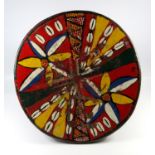 1920'S/30'S AFRICAN MALI BRIGHTLY PAINTED WOOD STOOL, A DISHED CIRCULAR SEAT WITH FLORAL, SHELL