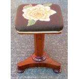 EARLY VICTORIAN MAHOGANY STOOL WITH A FLORAL NEEDLEWORK SEAT ON TAPERING HEXAGONAL COLUMN
