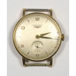 A GENTLEMAN'S 18 CT GOLD LONGINES WRISTWATCH WITH ARABIC NUMERALS AND BATON MARKERS, AND SECONDS