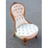 VICTORIAN WALNUT NURSING CHAIR WITH CARVED FLORAL DECORATION, ARCHED BACK AND OVAL SEAT