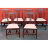 A SET OF SIX GEORGE III COUNTRY CHIPPENDALE MAHOGANY FINISH DINING CHAIRS, EACH WITH A PIERCED SPLAT