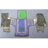 LATE 19TH/EARLY 20TH CENTURY CHINESE GUIZHOU ZHANGFENG STYLE MIAO SATIN AND CROSS- STITCHED BABY