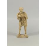 JAPANESE CARVED IVORY OKIMONO AS A FIGURE OF A MAN, STANDING AND HOLDING TWO IMPLEMENTS, MEIJI