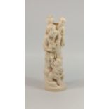 JAPANESE CARVED IVORY OKIMONO AS A FIGURE OF A MAN, STANDING AND HOLDING A RAT IN HIS RIGHT HAND,