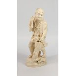 JAPANESE CARVED IVORY OKIMONO AS A FIGURE OF A FISHERMAN, STANDING AND ABOUT TO KILL A CARP, INCISED