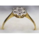 18CT GOLD AND PLATINUM RING, SIZE Q, OF FLORAL DESIGN SET SEVEN DIAMONDS, 2.3 GRAMS