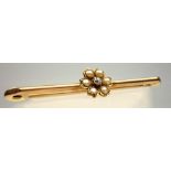 YELLOW METAL, DIAMOND AND SEED PEARL FLORAL BAR BROOCH STAMPED 9 CT, GROSS WEIGHT 3.5 GRAMS