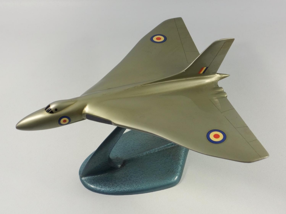 AVRO VULCAN - GOLD PAINTED METAL MODEL WITH DECALS (LENGTH 23 CM, WINGSPAN 24.5 CM) ON A METAL STAND