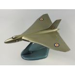 AVRO VULCAN - GOLD PAINTED METAL MODEL WITH DECALS (LENGTH 23 CM, WINGSPAN 24.5 CM) ON A METAL STAND