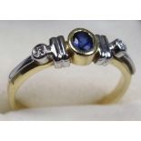 YELLOW METAL RING, STAMPED 585, SIZE P 1/2, SHOULDERS SET DIAMONDS WITH A CENTRAL OVAL CUT SAPPHIRE,