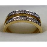 YELLOW METAL DOUBLE BAND AND ILLUSION SET DIAMOND RING, STAMPED 18 K AND 750, SIZE N 1/2, GROSS