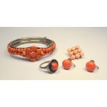 WHITE METAL HINGED BRACELET STAMPED 'EW 800' ENCRUSTED WITH CORAL, 25.9 GRAMS, A PAIR OF CORAL