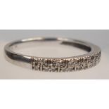 WHITE METAL AND DIAMOND HALF ETERNITY RING STAMPED 375, SIZE R 1/2, GROSS WEIGHT 2.3 GRAMS