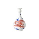 A blue and white with iron red porcelain vase, decorated with dragon and clouds. Marked with seal