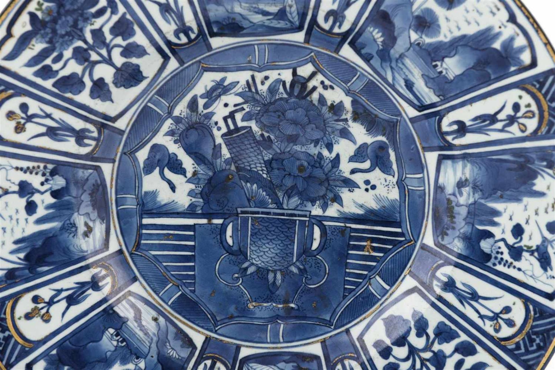 A large blue and white porcelain deep charger, decorated with flower vases and landscapes. Unmarked. - Image 2 of 3