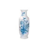 A blue and white porcelain vase, decorated with birds and flowers in the style of Wang Bu. Marked