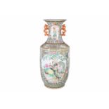 A polychrome porcelain vase with two handles, decorated with birds and flowers. Marked with seal